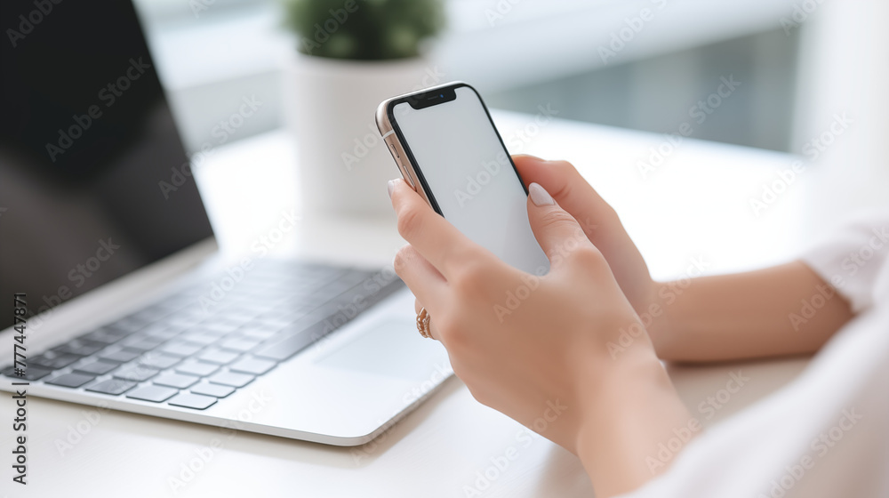 Closeup of business woman using and touching on mobile smart phone during working at home office Closeup of business woman using and touching on mobile smart phone during working at home office