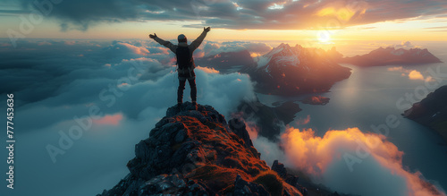 A climber reaches the summit of an exposed mountain top photo