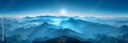 panorama view of mountains, The sun shines on the top of mountain, overlooking a wide view of mountains and valleys below.banner