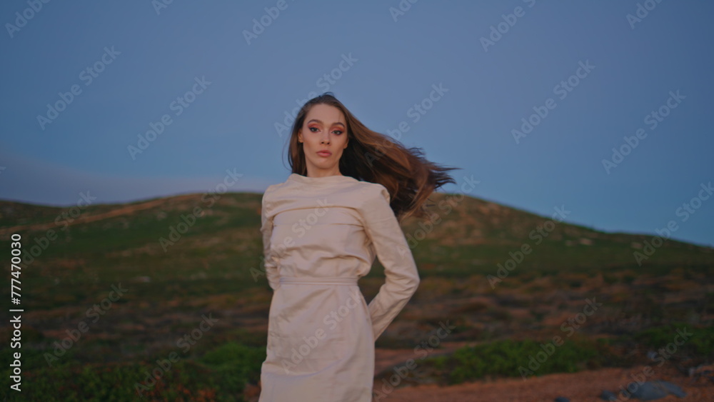 Active dancer performing nature green hills at summer evening. Woman dancing