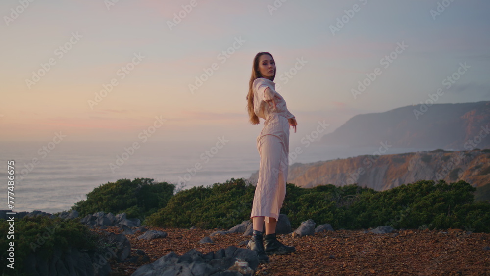 Lady artist dancing improvisation sunrise ocean hill. Woman modern choreography