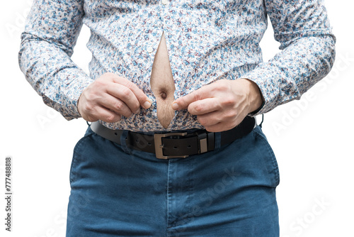 Overweight man with fat belly trying to fasten tight shirt, isolated on white background photo