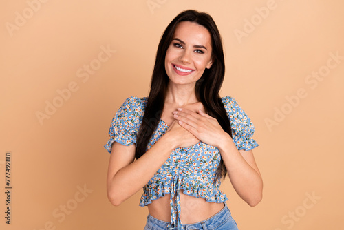 Photo of adorable lovely woman wear blue stylish spring print clothes arms chest isolated on beige color background