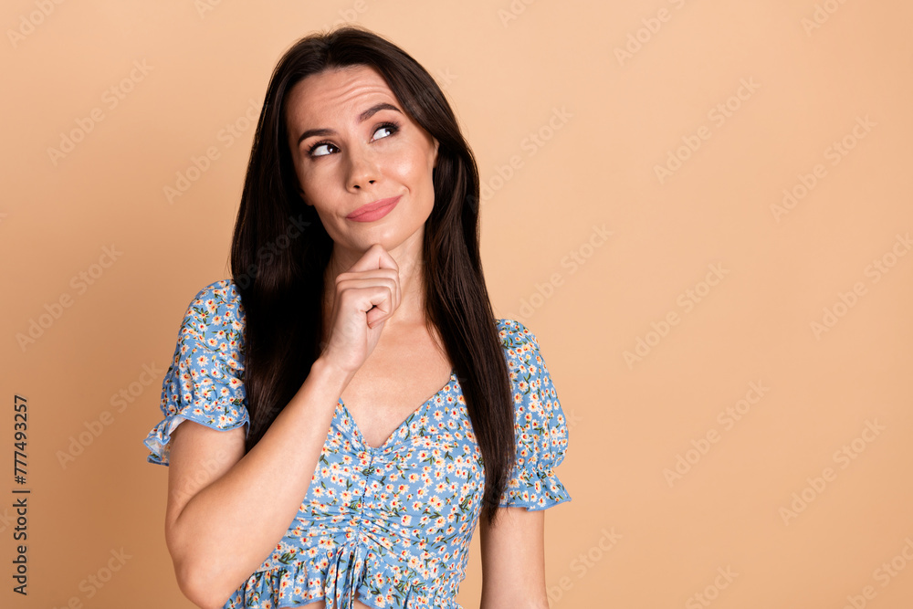 Photo of dreamy gorgeous lovely woman wear flowers print blue stylish clothes offer empty space isolated on beige background Photo of dreamy gorgeous lovely woman wear flowers print blue stylish clothes offer empty space isolated on beige background