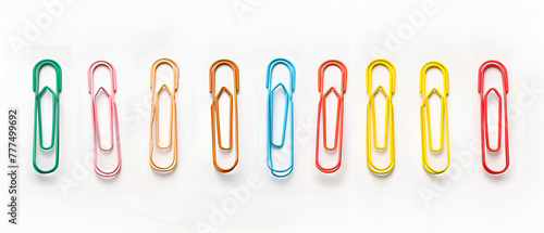 Multi colored paper clips, isolated on white background ,Set of colorful paper clips isolated on white ,Colorful zem clips on a white background
