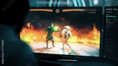 Hitting the opponent hero with combos in the online computer game tournament. Fighting an online enemy with combos in a tournament. Killing rival fighter using combos in the online esports tournament. photo