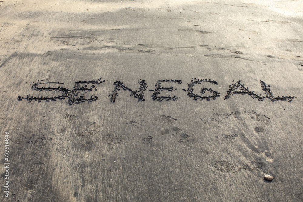 Fototapeta premium Beach in Ndayane, Senegal. The word Senegal written on sand
