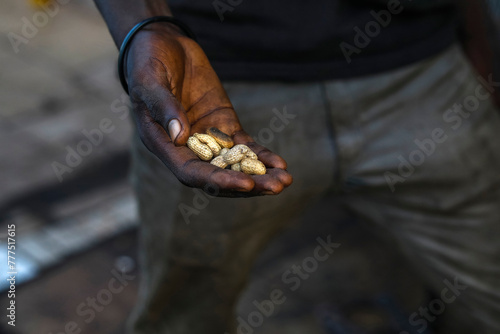 Man holding fresh peanuts in Toubacouta, Senegal