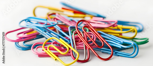 colorful paper clips isolated in white background ,Pile of multiple colorful office paper clips, isolated over the white background ,Bunch of colorful paper clips isolated on white