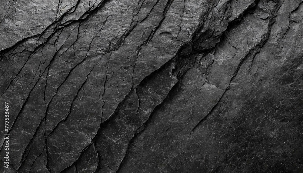 Rock texture with cracks,black stone background with copy space for design Rock texture with cracks,black stone background with copy space for design