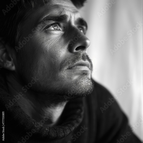 Pensive Man with Stubble in Black Turtleneck