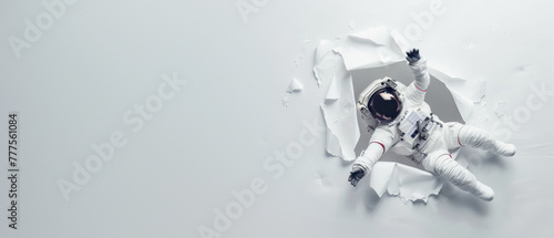 Dramatic visual of an astronaut emerging through paper, as if discovering a new dimension of space