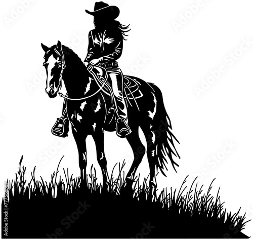 Silhouette of a cowgirl on a horse on top of a grassy hill 