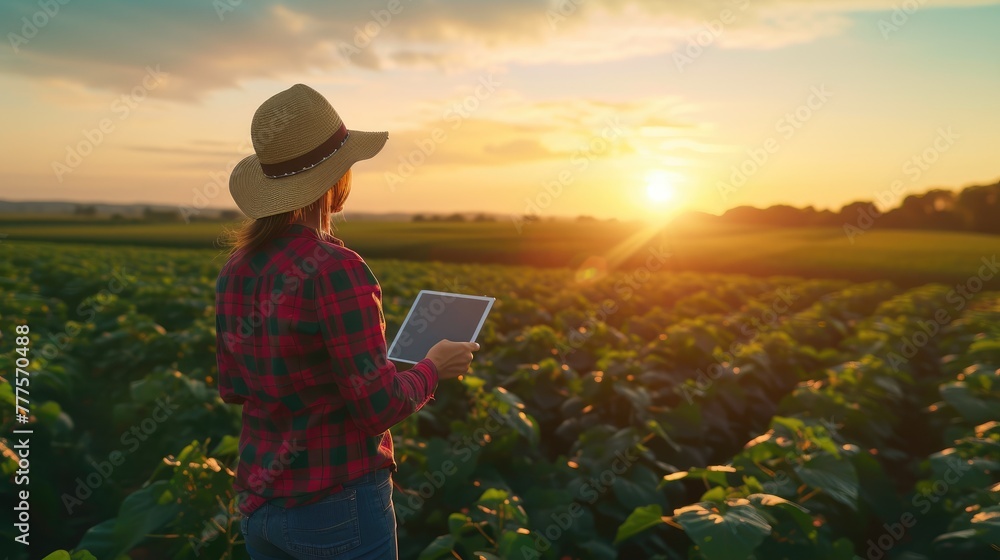 Fototapeta premium Smiling Female Farmer Checking Crops on Soybean Plantation