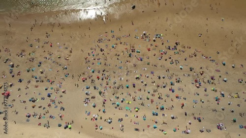 Beach goers in Biscarosse, France photo