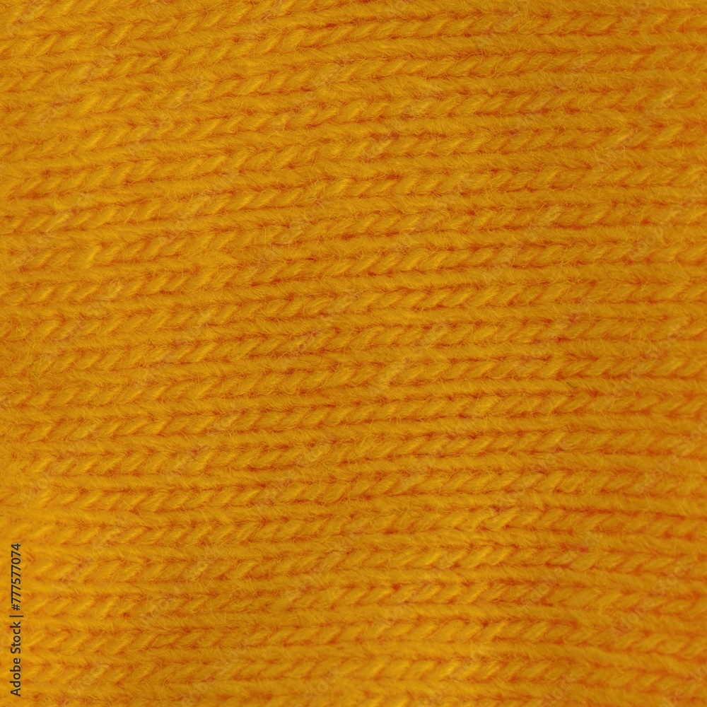 Obraz premium Yellow knitted background. Full frame