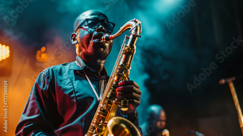 A man playing a saxophone on stage in front of a crowd. Scene is energetic and lively, as the man is performing in front of an audience