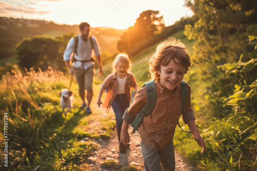 Fototapeta Naklejka Na Ścianę i Meble -  Happy family enjoying an outdoor adventure together, A joyful child leads a family hike along a countryside trail, bathed in the warm light.