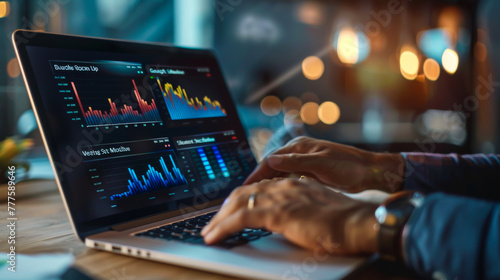 A person is typing on a laptop with a stock market graph on the screen. The person is focused on the screen and he is working on something related to finance or trading. photo