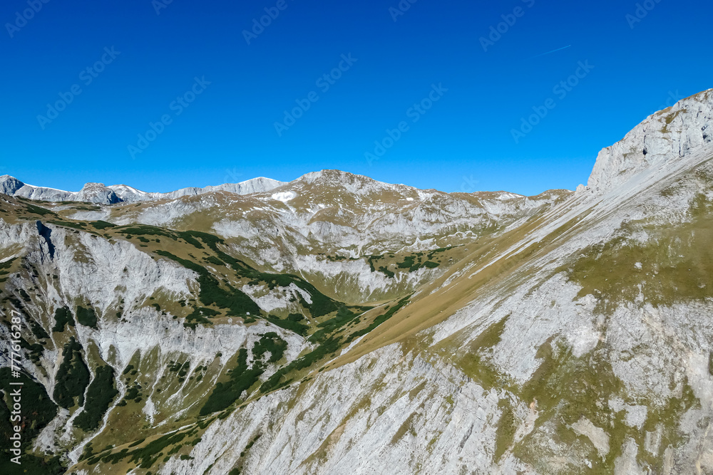 Panoramic view of majestic mountain peak Hochschwab and Zagelkogel in untamed Hochschwab massif, Styria, Austria. Scenic hiking trail on sunny day in remote Austrian Alps. Wanderlust in alpine spring Panoramic view of majestic mountain peak Hochschwab and Zagelkogel in untamed Hochschwab massif, Styria, Austria. Scenic hiking trail on sunny day in remote Austrian Alps. Wanderlust in alpine spring