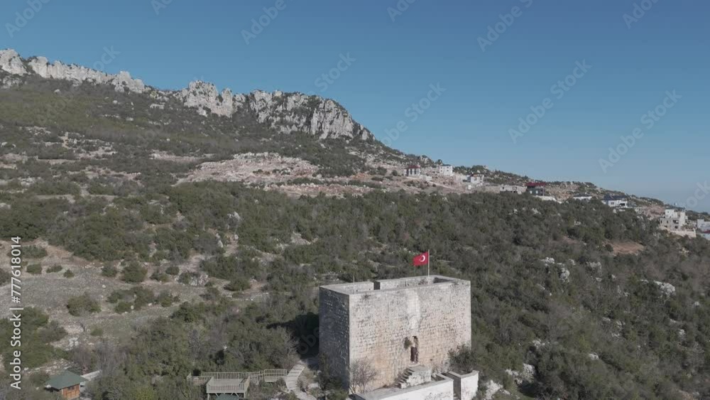 The flag on top of the castle building on the mountaintop, Belenkeşlik Castle, Turkey The flag on top of the castle building on the mountaintop, Belenkeşlik Castle, Turkey