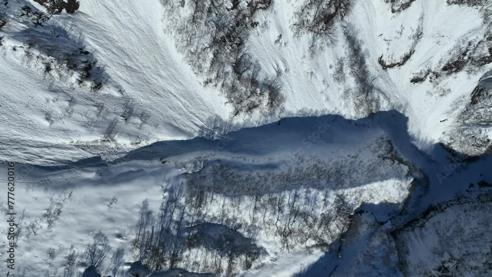 Tracking top down shot of Japan's mount myōkō valley, massive height of