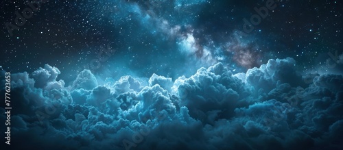 The night sky is covered with clouds, revealing twinkling stars shining through.