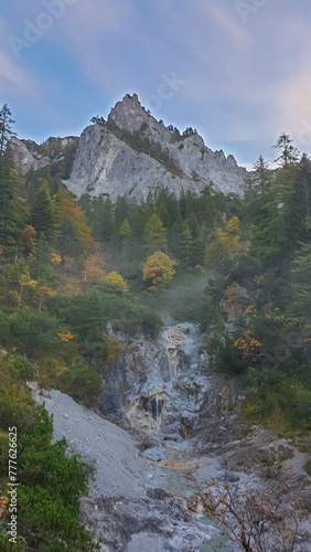 Scenic view of unique rock formation seen from Karlbach in Hochschwab mountain range, Styria, Austria. Hiking trail in alpine forest. Remote Austrian Alps in summer. Escapism. Connect with nature photo