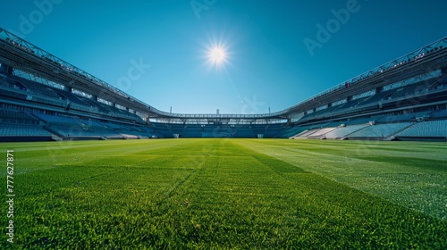Empty stadium basking in sunlight, shadows on the field.