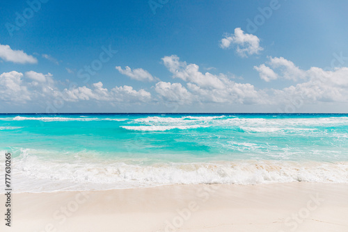Pristine turquoise water and white sand at Cancun beach photo
