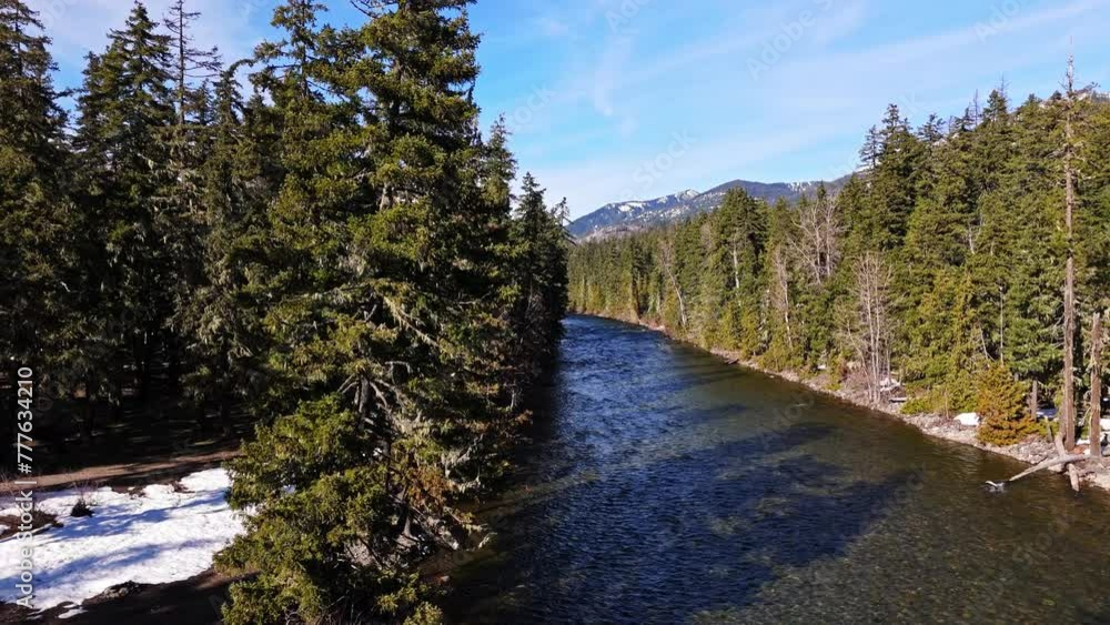 Smooth motion shot of river and forest in Cle Elum on a clear blue sky day in Washington State. Smooth motion shot of river and forest in Cle Elum on a clear blue sky day in Washington State.