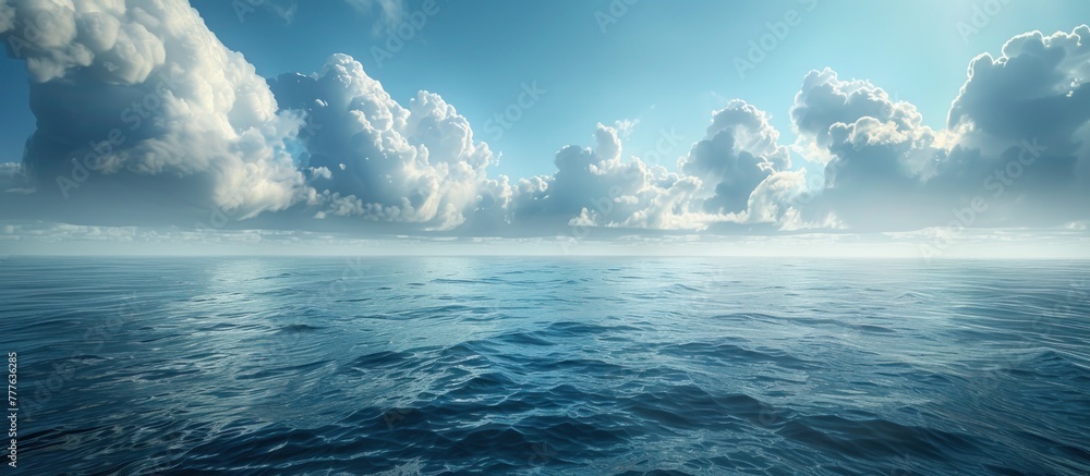 A large body of water, the ocean, is shown surrounded by thick clouds gathering in the sky.