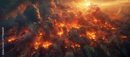 Aerial view of a massive amount of smoke and fire filling the sky, indicating a raging wildfire.