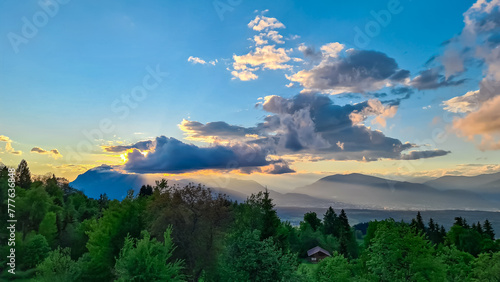 Scenic sunset view of iconic mountain peak Dobratsch seen from Altfinkenstein at Baumgartnerhoehe, Carinthia, Austria. Tranquility on hiking trail. Overlooking Villach area surrounded by Austrian Alps