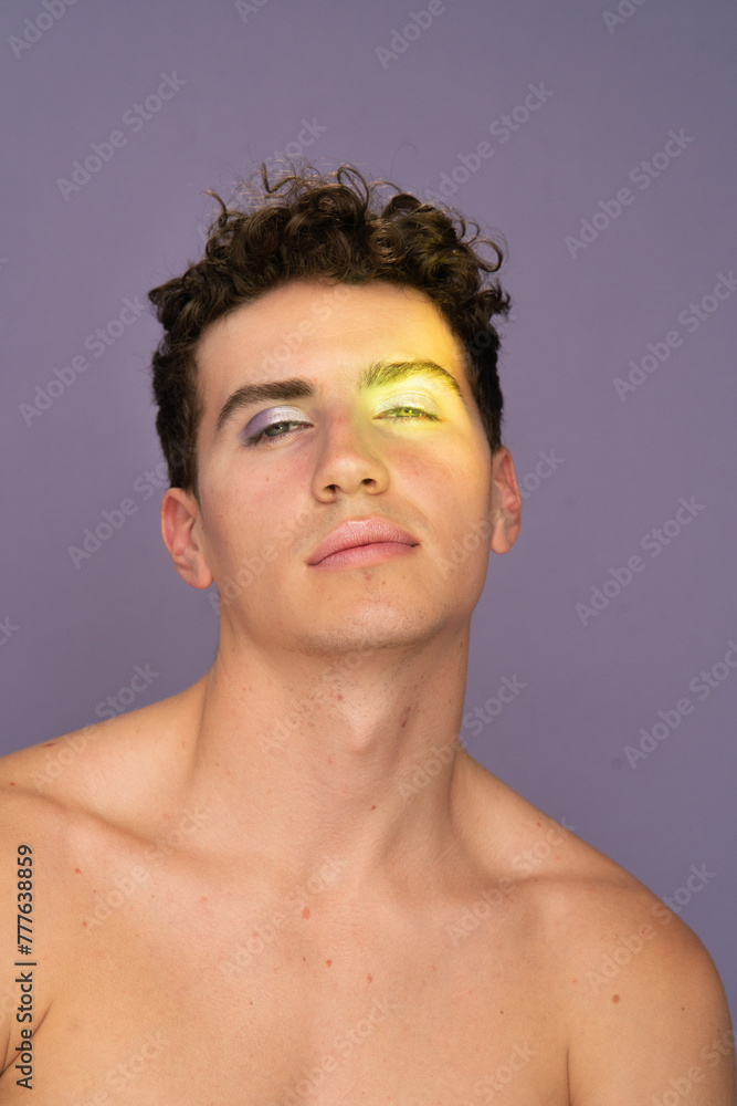 Male Model in Makeup Look Poses in Studio Male Model in Makeup Look Poses in Studio