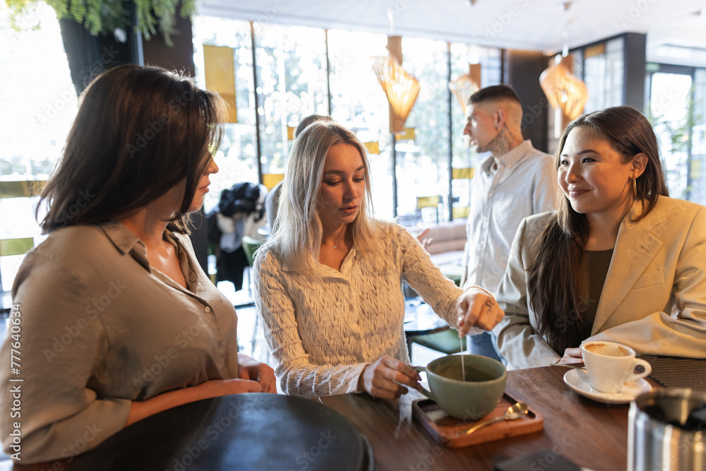 group of friends waiting for a table to eat in a restaurant group of friends waiting for a table to eat in a restaurant