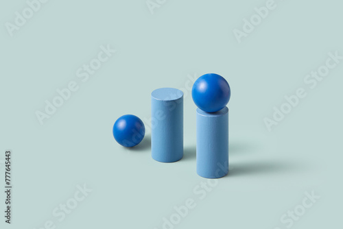 Minimalist composition of blue geometric spheres and cylinders