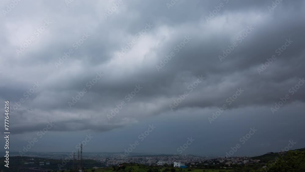 Epic timelapse of Dramatic rainy clouds over a city creating a moody scene. Shot in 4K ultra HD 60fps for the smoothest and the clearest experience. Epic timelapse of Dramatic rainy clouds over a city creating a moody scene. Shot in 4K ultra HD 60fps for the smoothest and the clearest experience.
