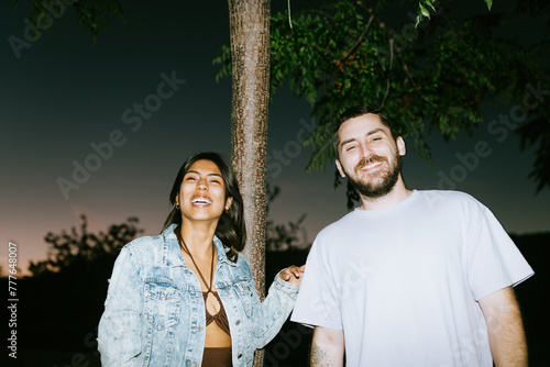 Couple's Laughter in Nighttime Park photo