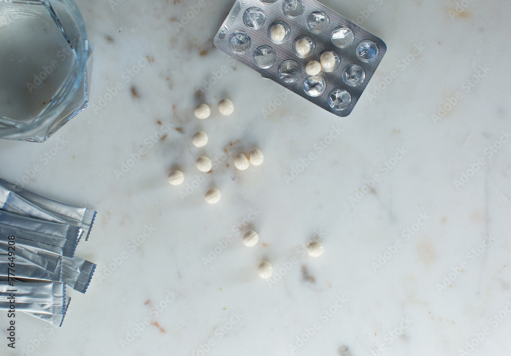 HRT medication on a white marble background HRT medication on a white marble background