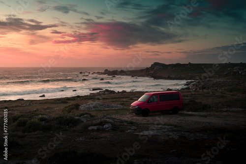 Camper van parked at dreamlike twilight wild coast