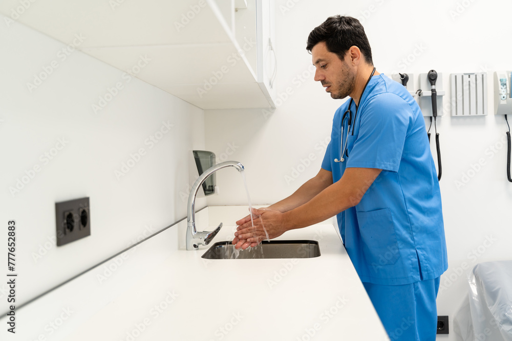 a doctor washing hands in the operation room at hospital a doctor washing hands in the operation room at hospital