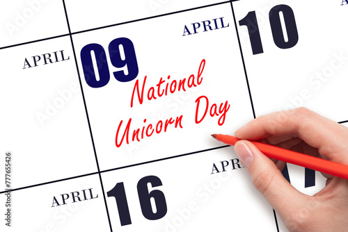 April 9. Hand writing text National Unicorn Day on calendar date. Save the date. © Alena