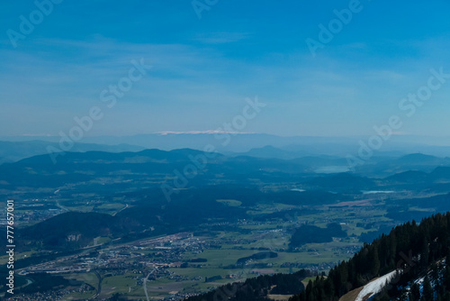 Panoramic view from Dreilaendereck on Rosental valley in Carinthia, Austria. Borders between Austria, Slovenia, Italy. Looking at alpine landscape of hills, lakes and forest. Hiking in early spring