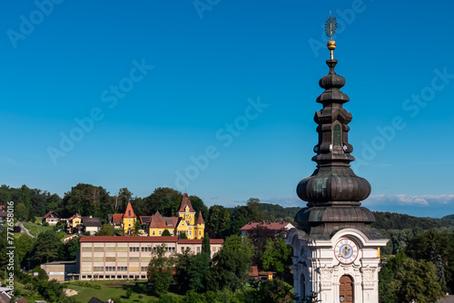 Panoramic aerial view of Ehrenhausen town with the clock tower of the Catholic pilgrimage church in foreground, Leibnitz, south Styria, Austria. Well known wine region in South West Styria photo