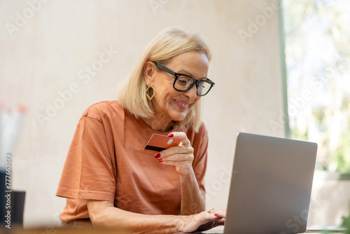mature woman online shopping  photo