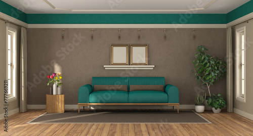 Elegant living area with teal sofa set, stylish greenery, and modern wall decor