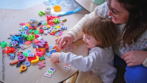 Caucasian Mother Homeschooling her Preschooler Girl Playing with Toy Letter Magnets Teaching Aid