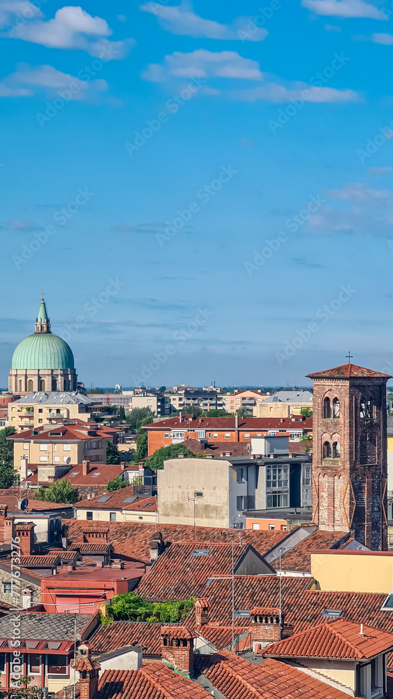 Obraz premium Scenic view of Parish of San Nicolo Vescovo at the Ossuary Temple in tourist town Udine, Friuli Venezia Giulia, Italy, Europe. Aerial viewing point of urban landscape. Travel destination in summer