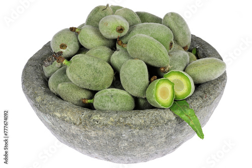 green almonds (cagla badem) from Turkey in a stone bowl isolated on white background